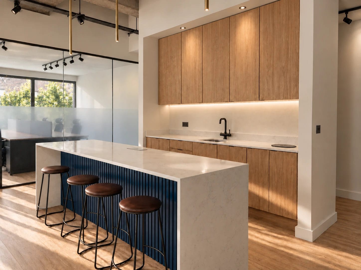 The kitchen at ShiftWorks Royal House, Chester, with an island and bar stools